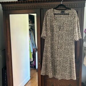 Size 22 leopard prints. Mid length dress has a tie in the back and a V-neck.